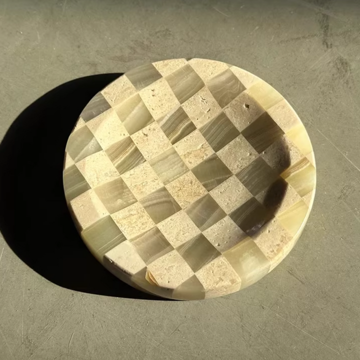 Artisan-crafted checkerboard tray combining jade marble and travertine, displayed in warm, natural lighting.