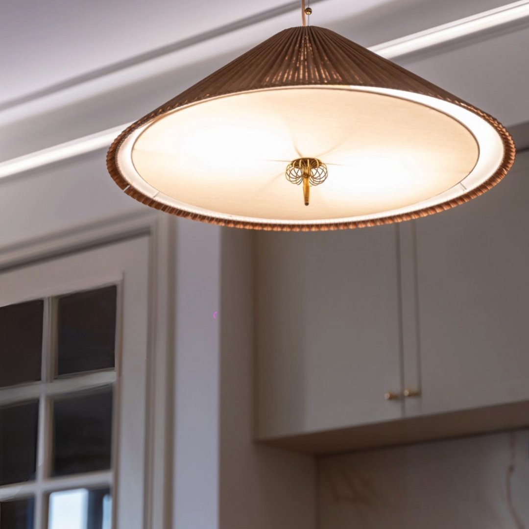 Japandi-style dining corner with warm bamboo pendant lighting