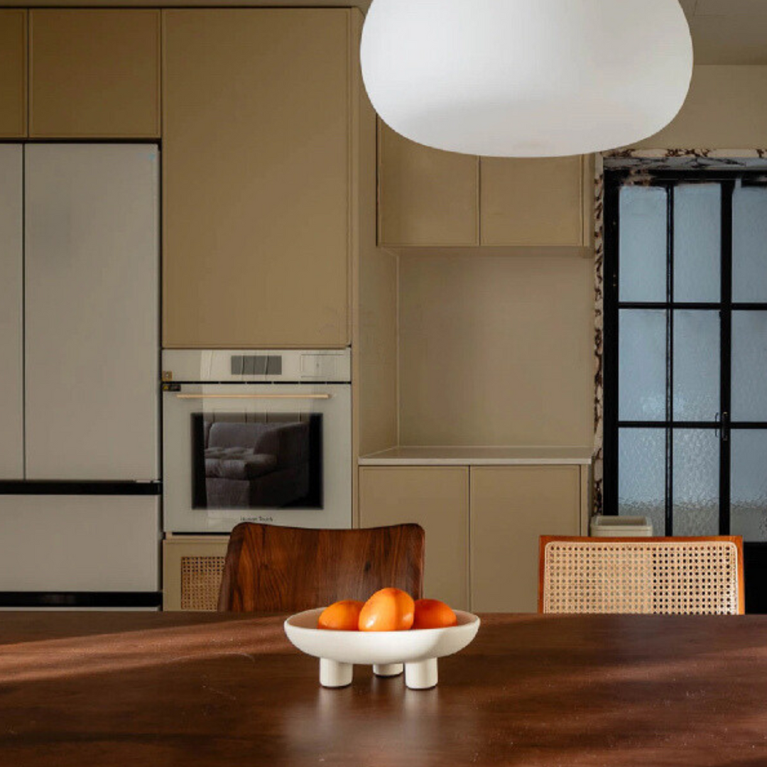 Contemporary fruit bowl sitting on a wooden table, blending effortlessly into minimalist and modern home decor.