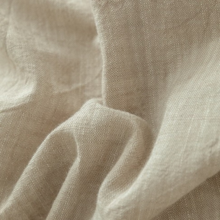 Close-up of linen fabric texture, highlighting the fine weave and quality material