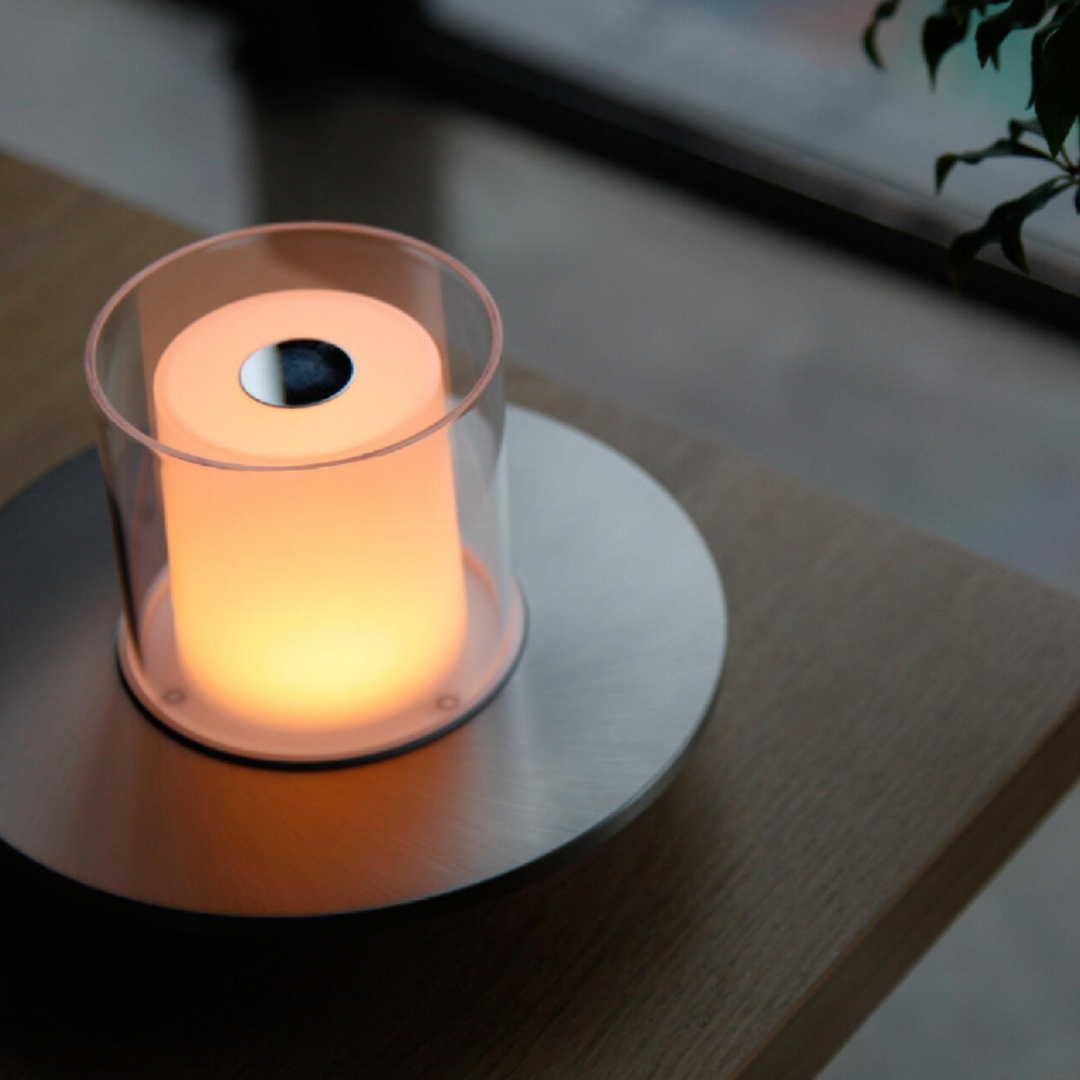 Compact candlelight table lamp with a sleek modern design, perfect for contemporary interiors.