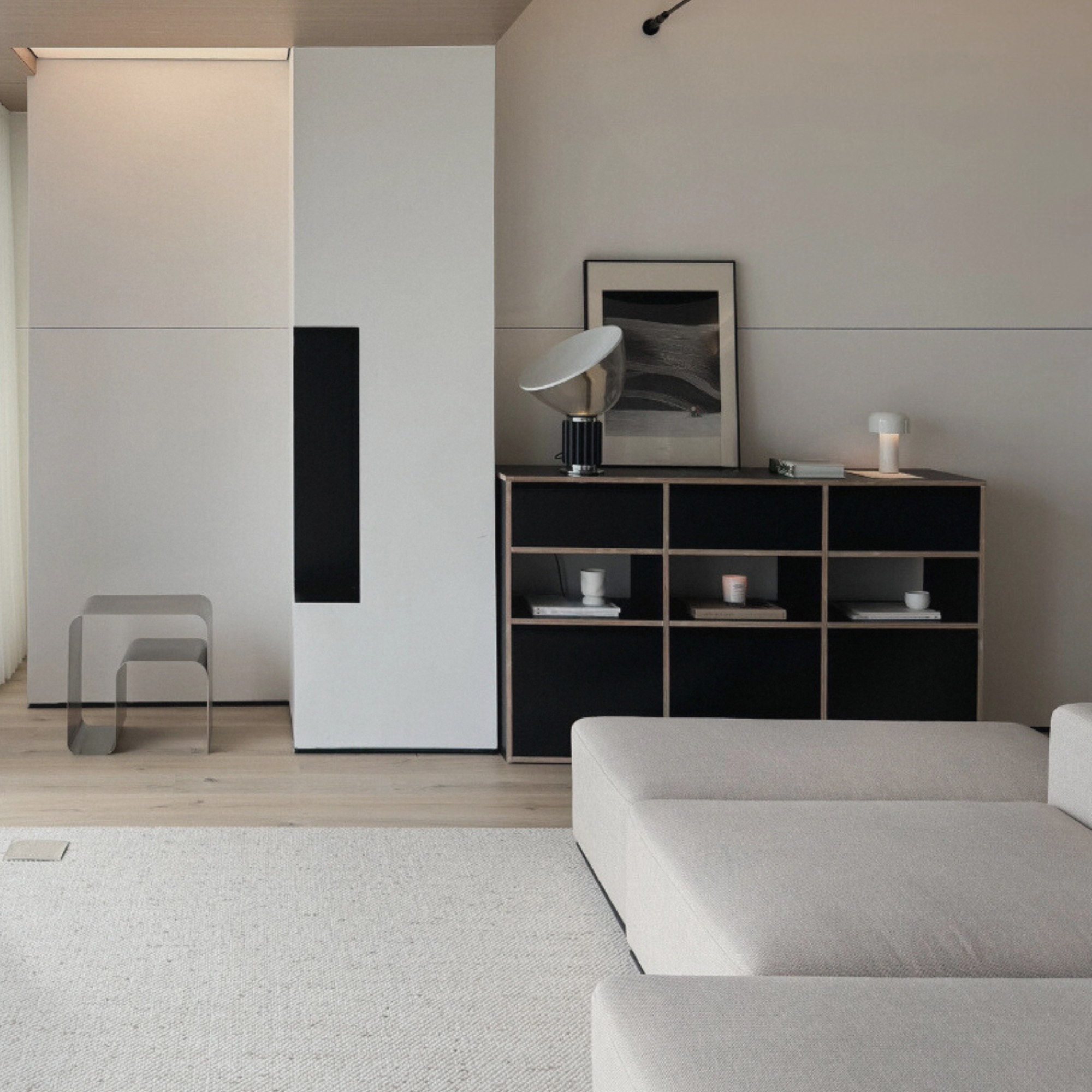 A cordless mushroom lamp on a modern black shelf with contemporary decor.