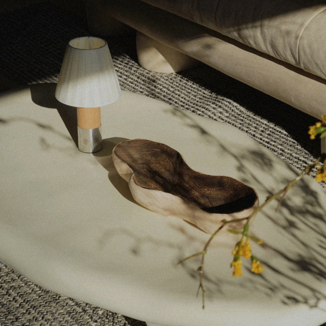 cordless table lamp used on a coffee table with decorative objects.