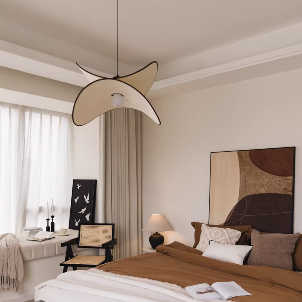 Elegant lighting fixture enhancing the aesthetic of a contemporary bedroom.