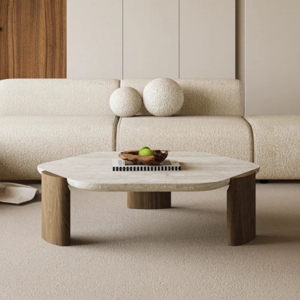 Elegant coffee table design with a natural travertine top and wooden legs in a stylish living room