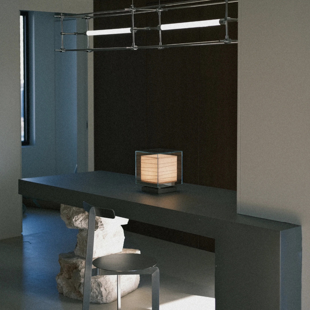 glass table lamp placed on a shelf adding subtle lighting to the space.