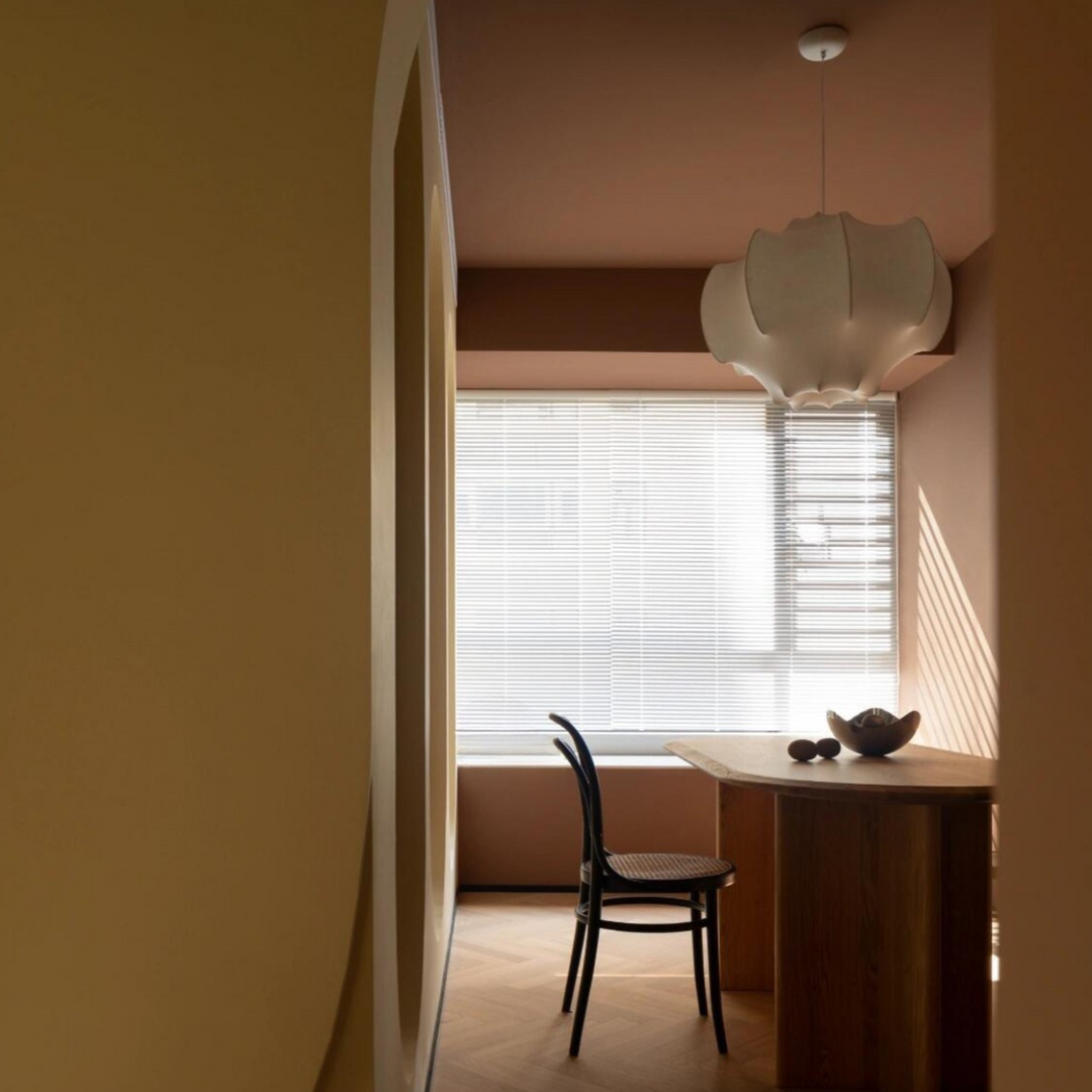 Handcrafted pendant light enhancing a modern kitchen space with natural light and a sleek, minimalist design.