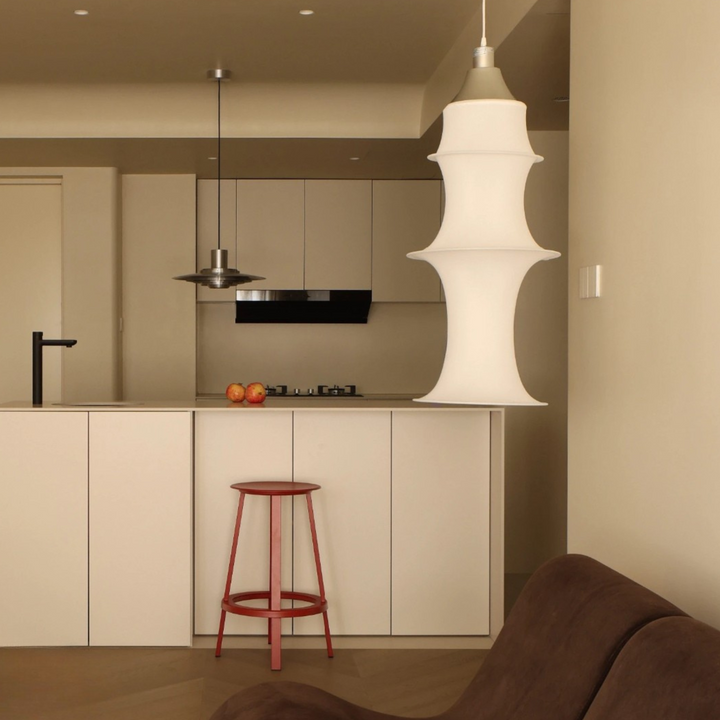 Japandi pendant light with sculptural curves above modern kitchen island