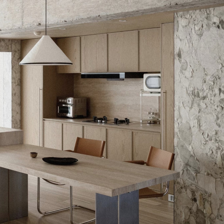 pendant light hanging above a kitchen island in a contemporary kitchen.