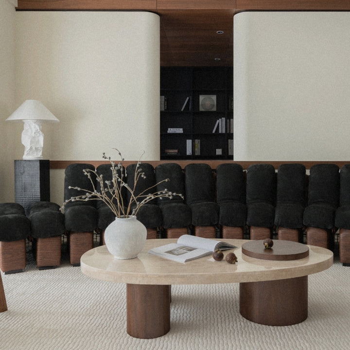 table lamp styled on a round coffee table in a modern living room.