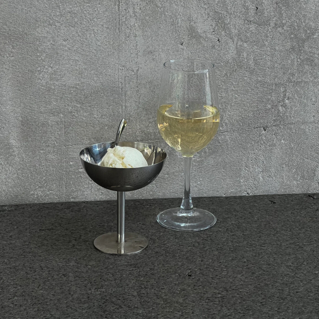 Elegant stainless steel coupe styled with ice cream, perfect for luxury dining settings or minimalist kitchens.