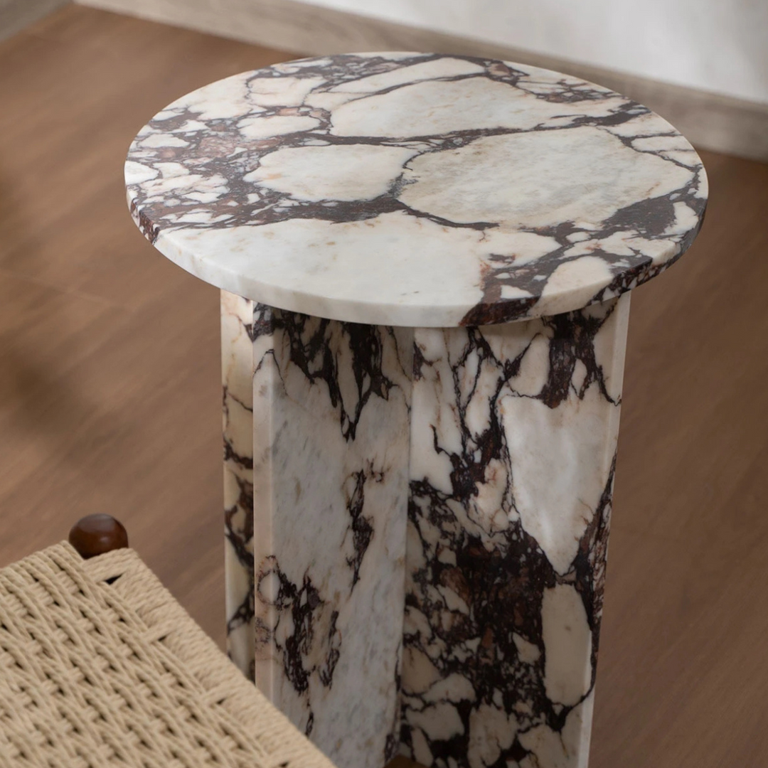 Close-up angled detail of polished marble surface, showing the natural veining of the stone