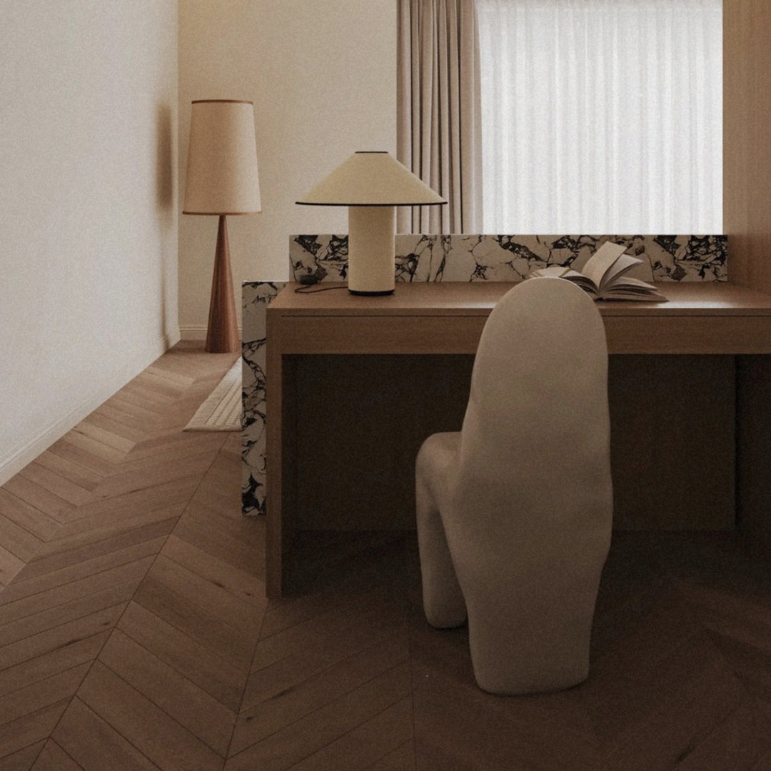 minimal table lamp used as bedroom lighting on a clean desk setup.