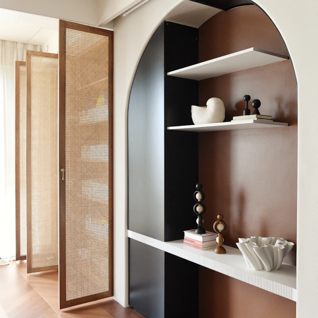 Minimalist Sandalwood candleholders displayed on a decorative shelf, showcasing natural wood craftsmanship.