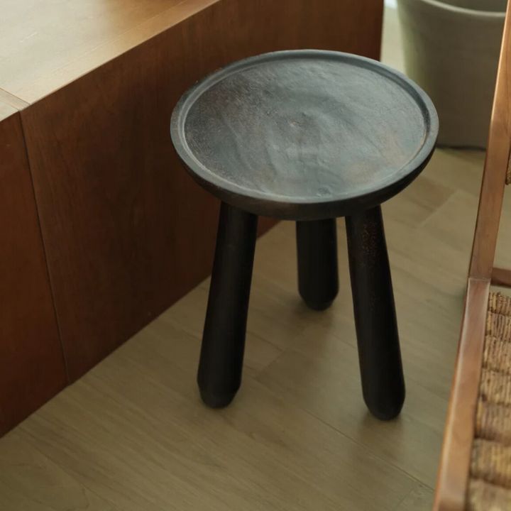 Minimalist dark wood side table with a rustic finish, perfect for natural and Wabi-Sabi interiors.