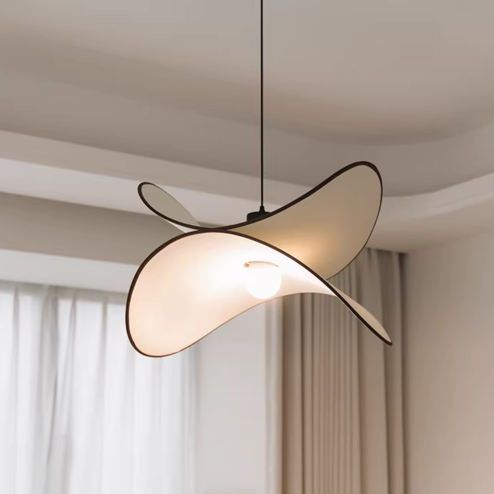 Minimalist light fixture in a modern interior, casting a soft glow.