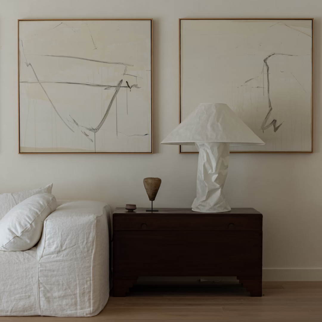 Minimalist table lamp styled in soft, modern white interior.