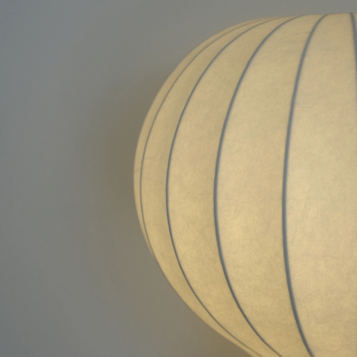 Statement table lamp styled in a modern apartment with clean black console.