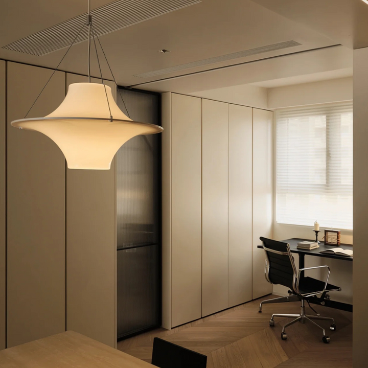 Mid-century modern dining room with a stylish pendant light enhancing the vintage decor.