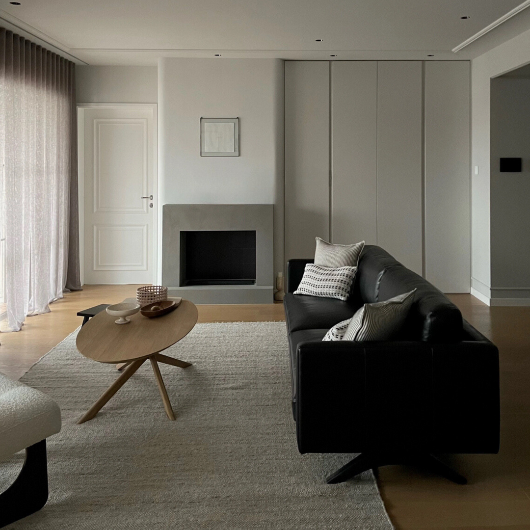 Travertine bowl enhancing a modern living room with minimalist style.