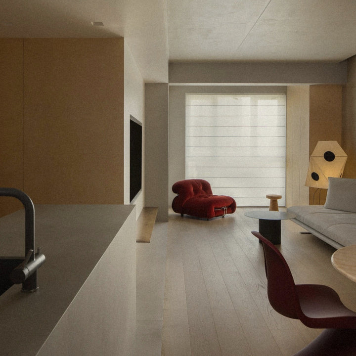 modern floor lamp illuminating an open plan living area with warm diffused light.