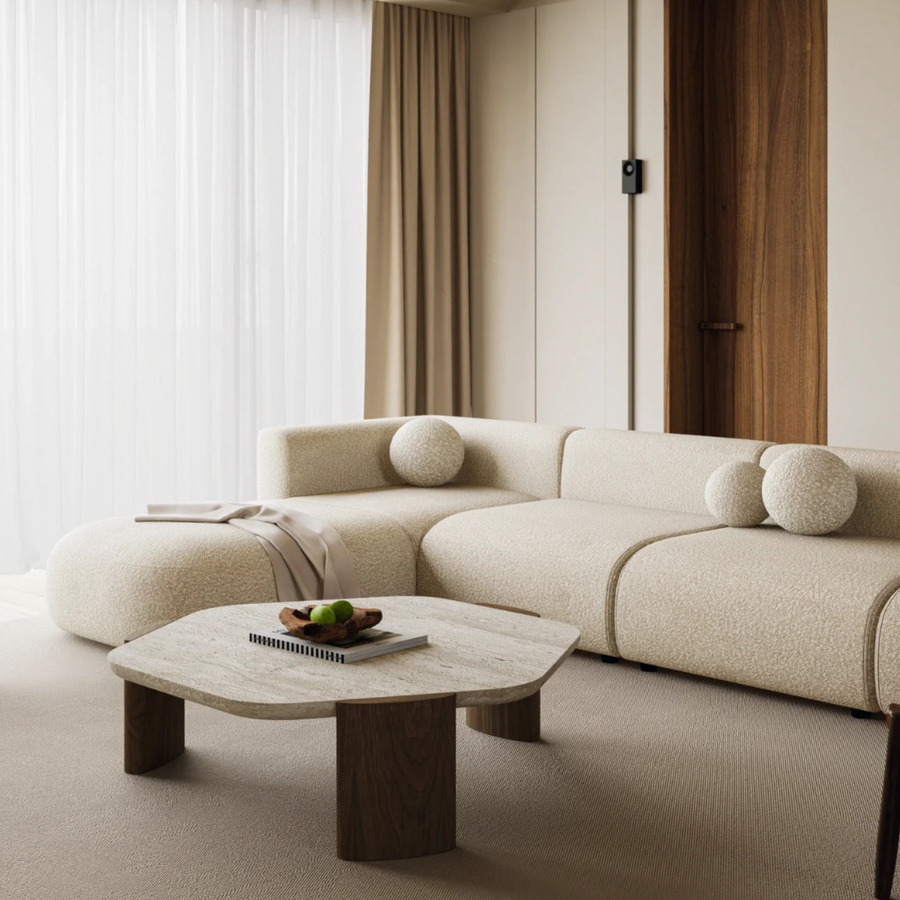 Modern home decor with a coffee table featuring a travertine top and sturdy oak legs