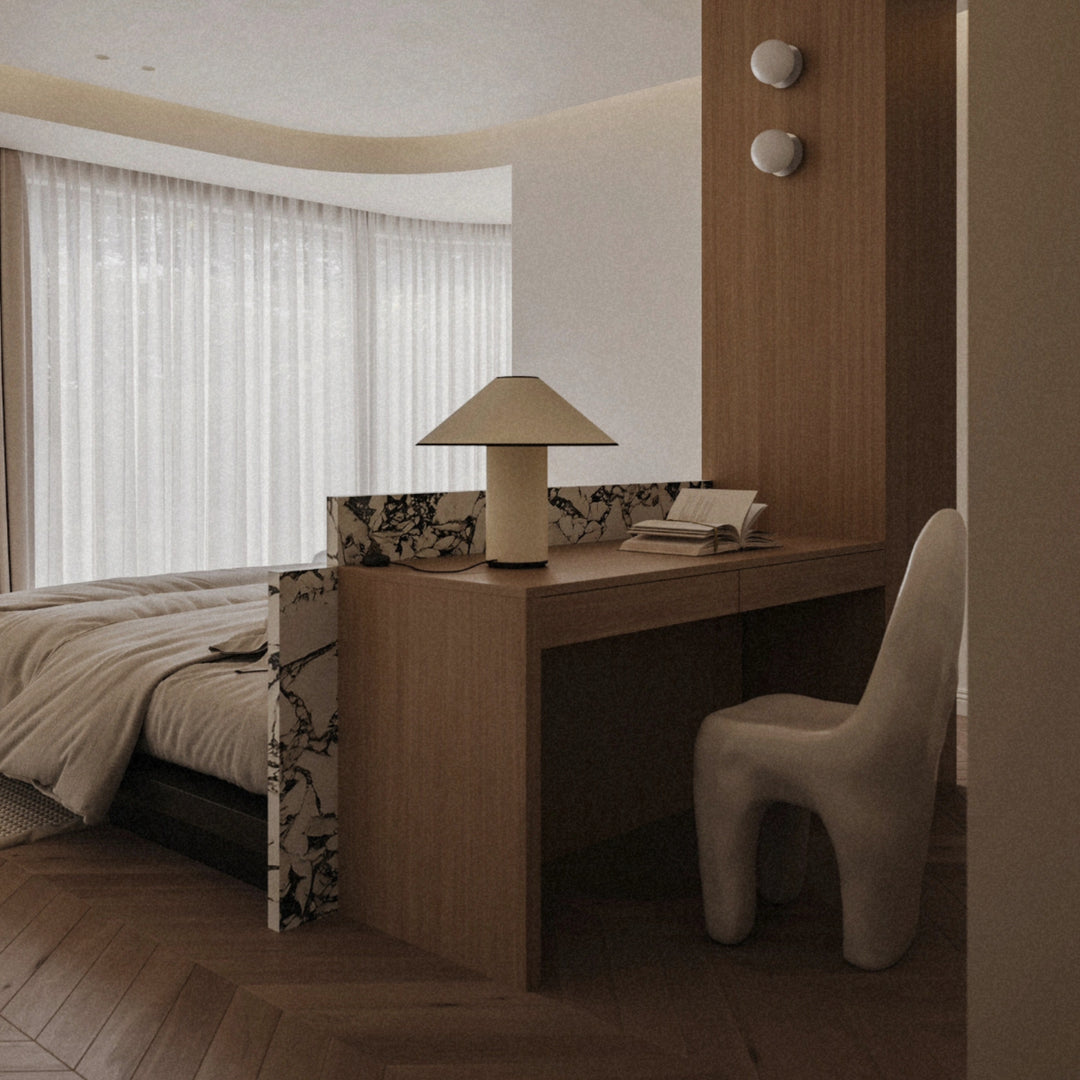 modern table lamp placed on a desk within a contemporary bedroom.