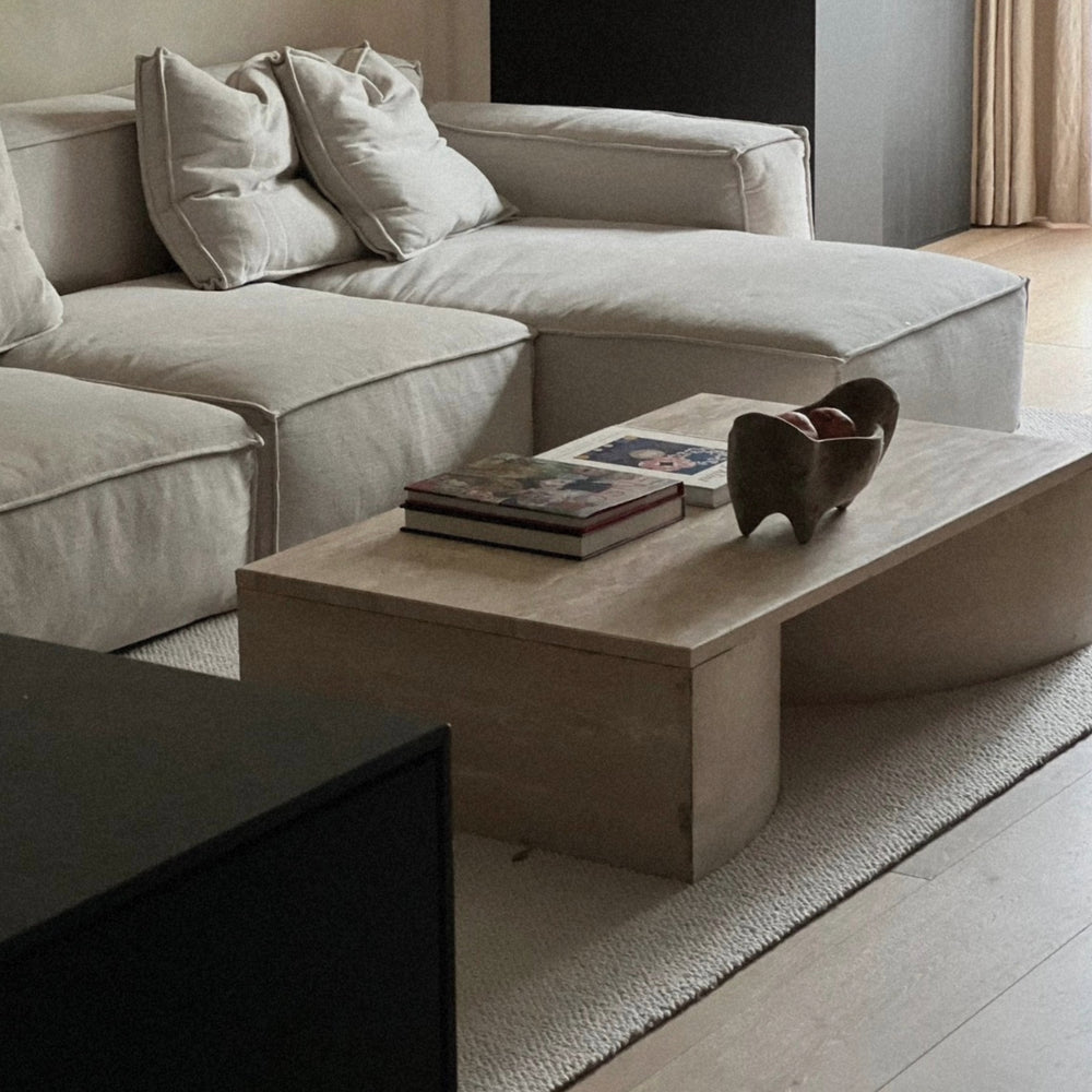 modern wooden serving bowl positioned on a coffee table creating a subtle focal point in a living room.