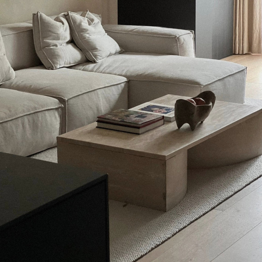 modern wooden serving bowl positioned on a coffee table creating a subtle focal point in a living room.