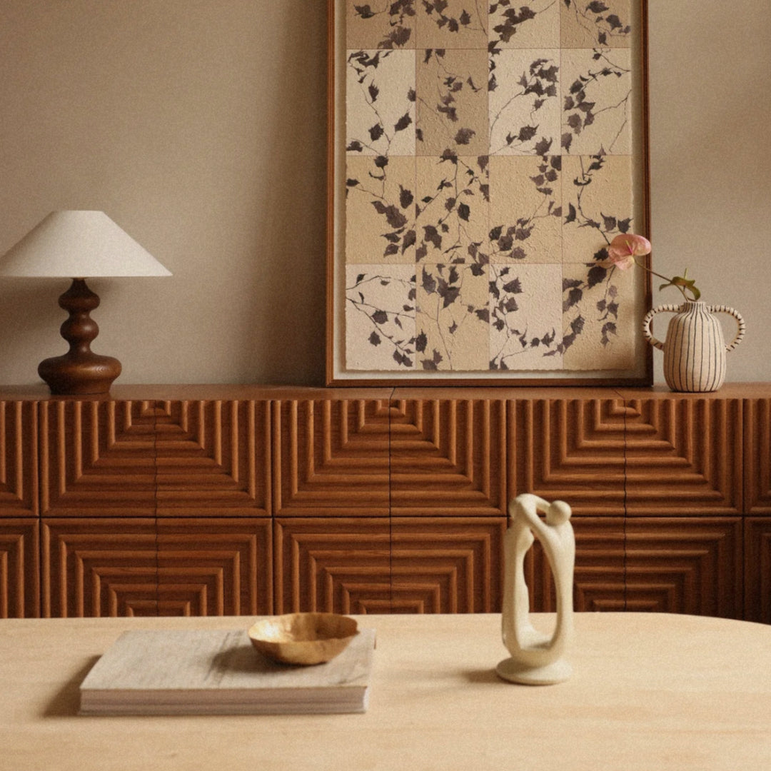 modern wood table lamp styled behind a dining table in a warm interior.