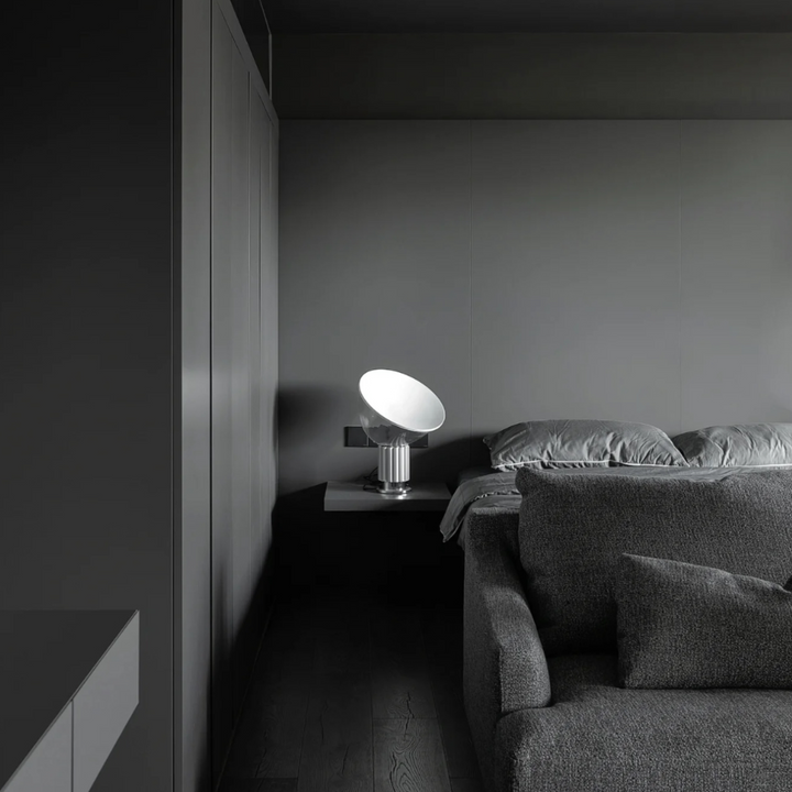 Monochrome bedroom with minimalist modern lamp