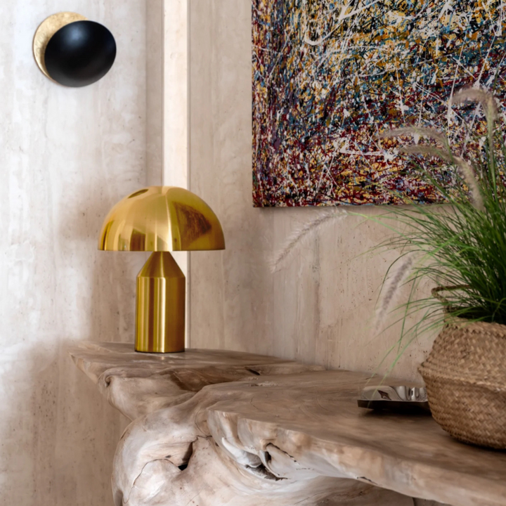 Mushroom-shaped table lamp on a rustic console table in a modern interior.