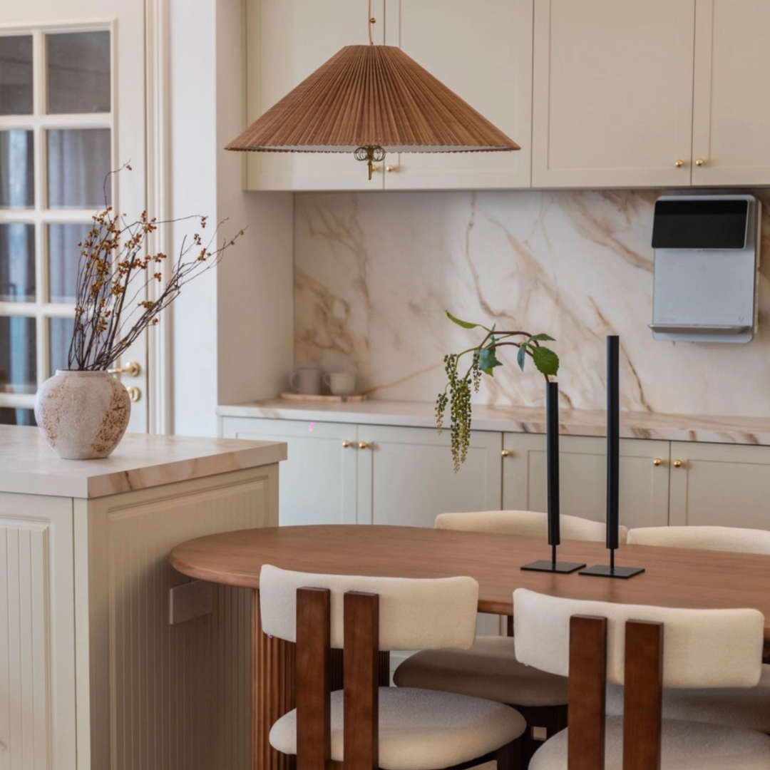 Natural pendant lamp softly lighting a calm living and dining space