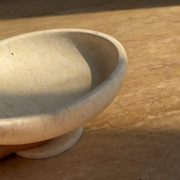 Natural travertine bowl reflecting Wabi-Sabi-inspired aesthetics.