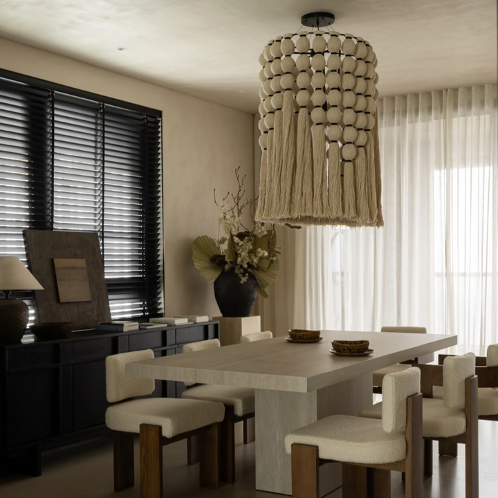 Neutral home lighting above a minimalist Japandi dining room interior