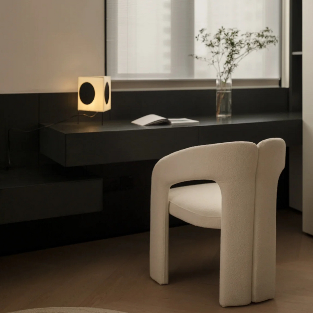 Modern lamp on an office desk, providing a functional and stylish lighting element.