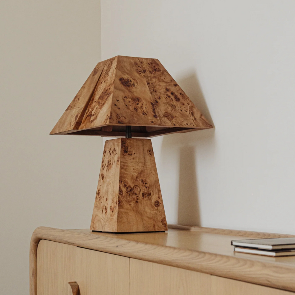 Rustic table lamp made from burl bark, ideal for modern decor and adding a touch of nature to any room.