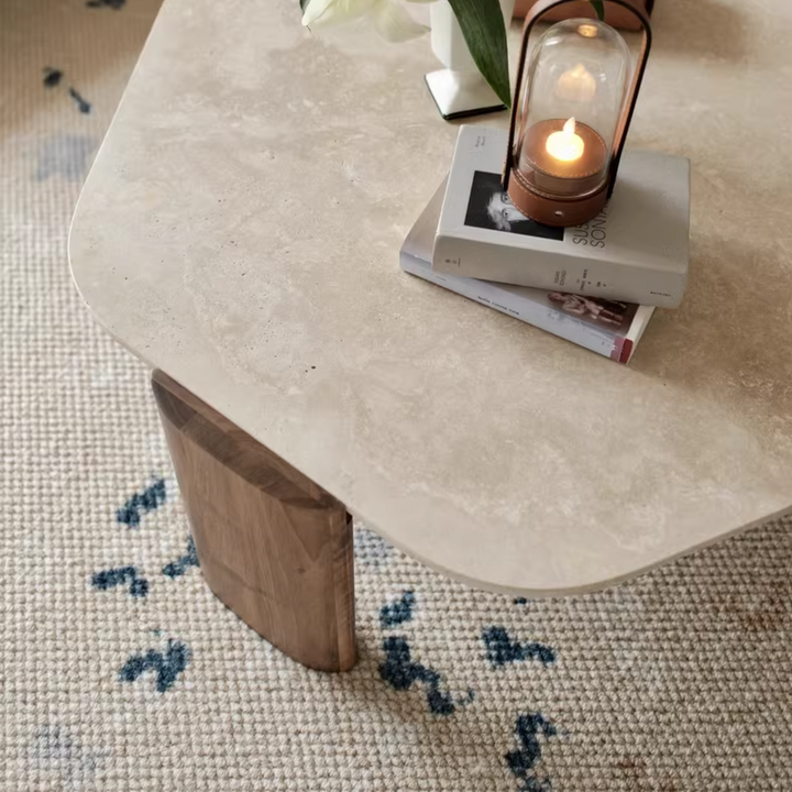 Scandinavian style coffee table with natural travertine top and wooden legs