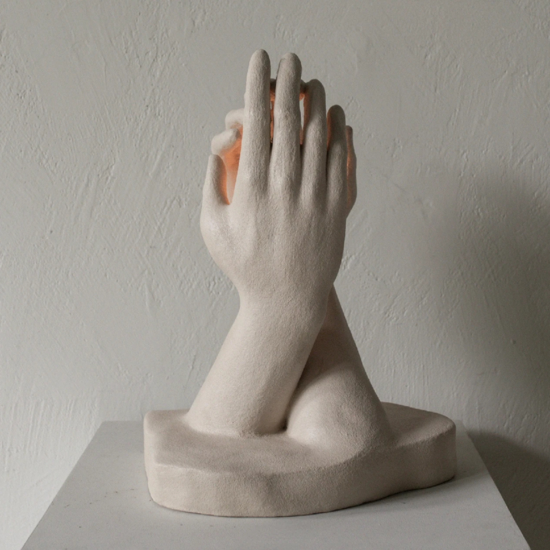 Sculptural candle holder with organic shape under soft light