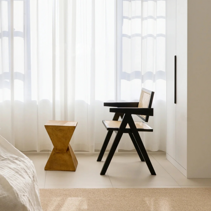 Side table with a rattan chair