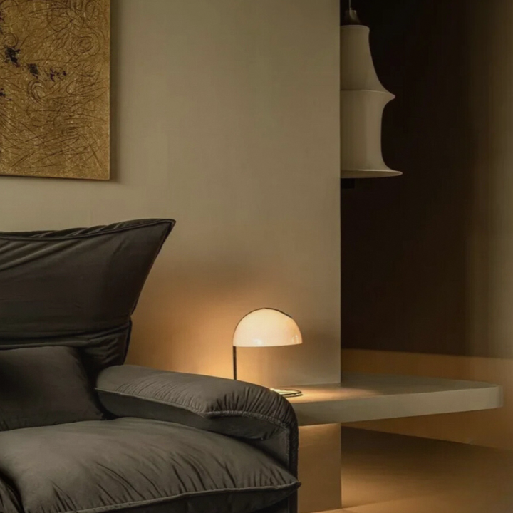 Elegant table lamp with a soft, warm light, perfect for creating a serene and inviting bedroom atmosphere.