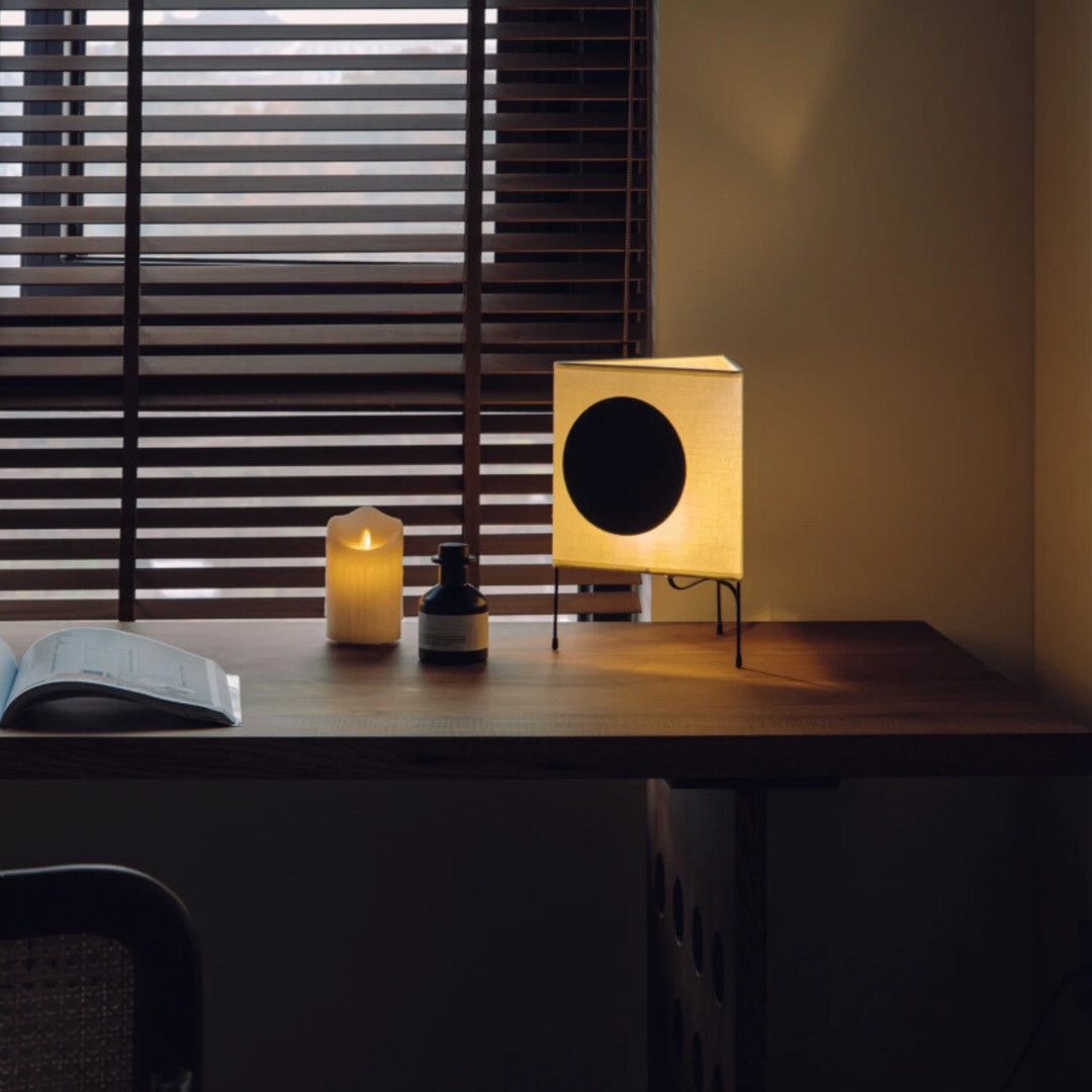 Stylish lamp on a work desk, enhancing productivity with its focused light.