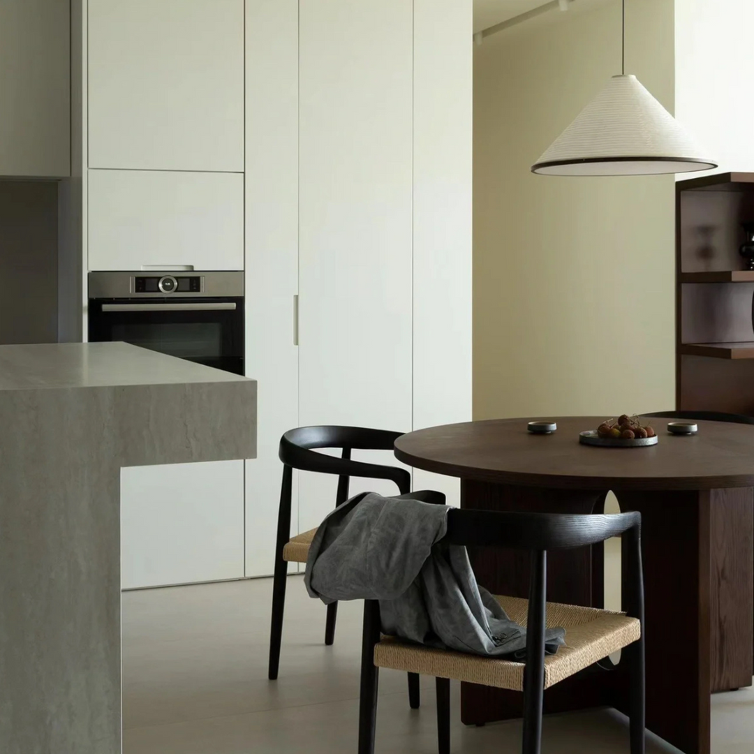 Organic cotton paper lighting illuminating a neutral modern kitchen with elegant simplicity.