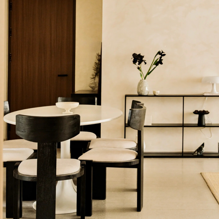 Decorative travertine bowl in a neutral interior with minimalist design.