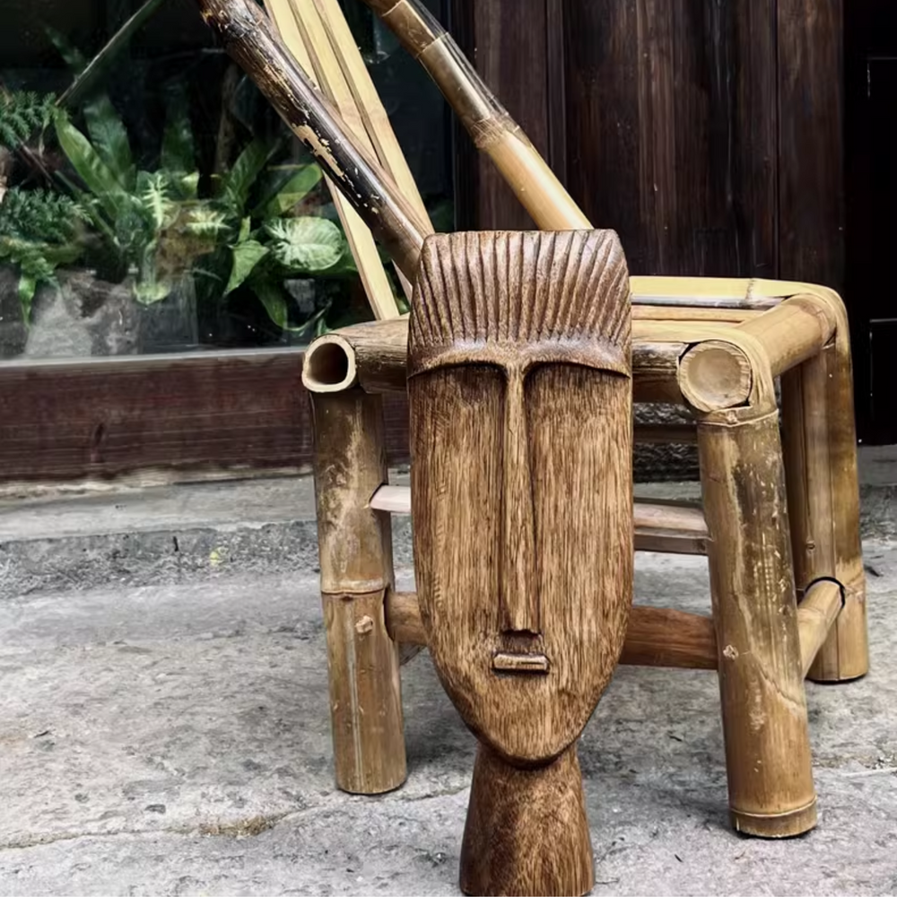 Unique wooden sculpture with intricate details in an outdoor setting