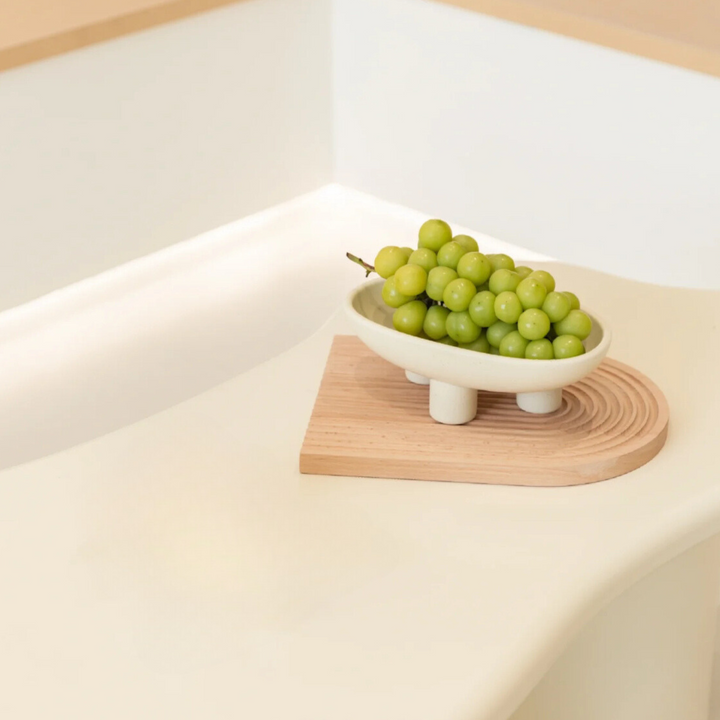 Decorative fruit bowl with an organic shape and minimalist design, enhancing Wabi-Sabi-inspired interiors.