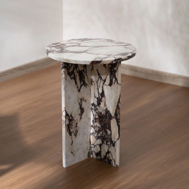 Wabi-sabi inspired side table featuring raw marble texture and intentional imperfection