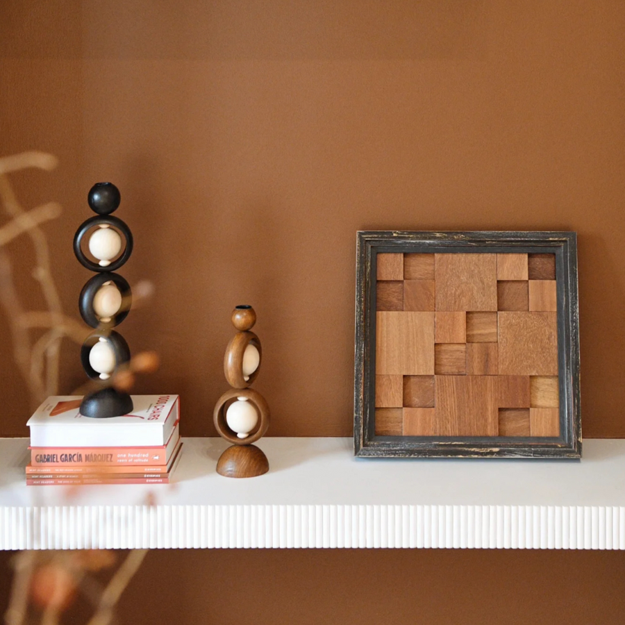 Handcrafted Wabi-Sabi candleholder made from rare Sandalwood displayed on a minimalist shelf.