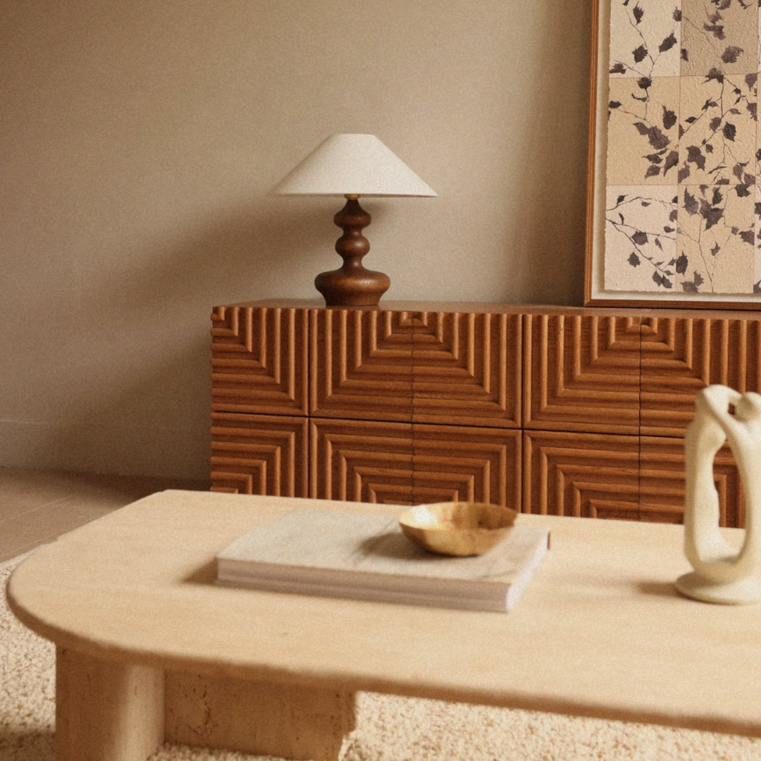 wood table lamp placed on a table creating a calm lighting accent.