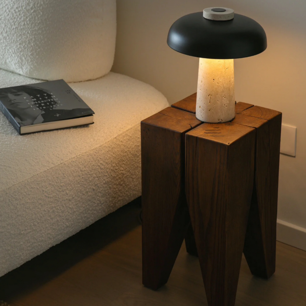 Wooden stool with a lamp on top, perfect for cozy and contemporary spaces.